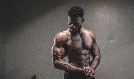 colored man working out with optimal bicep volume