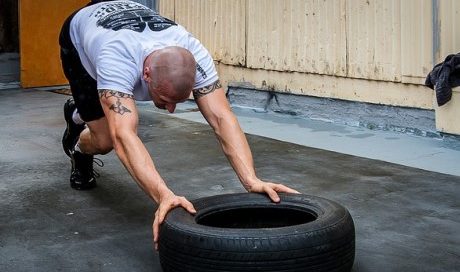 Man doing intense HIT training for proper muscle growth